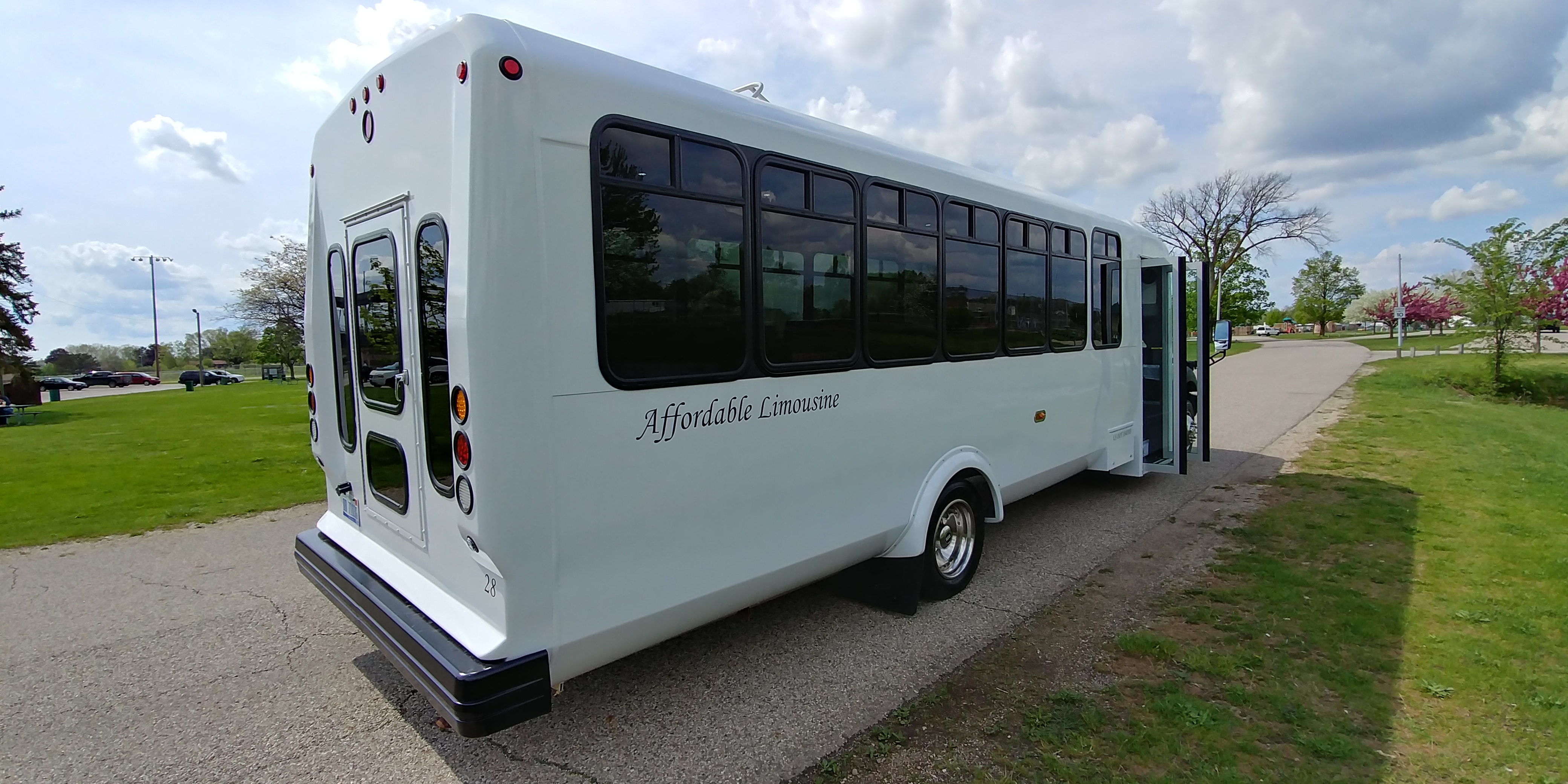 28 Passenger Luxury Limo Bus Passenger's Side Rear